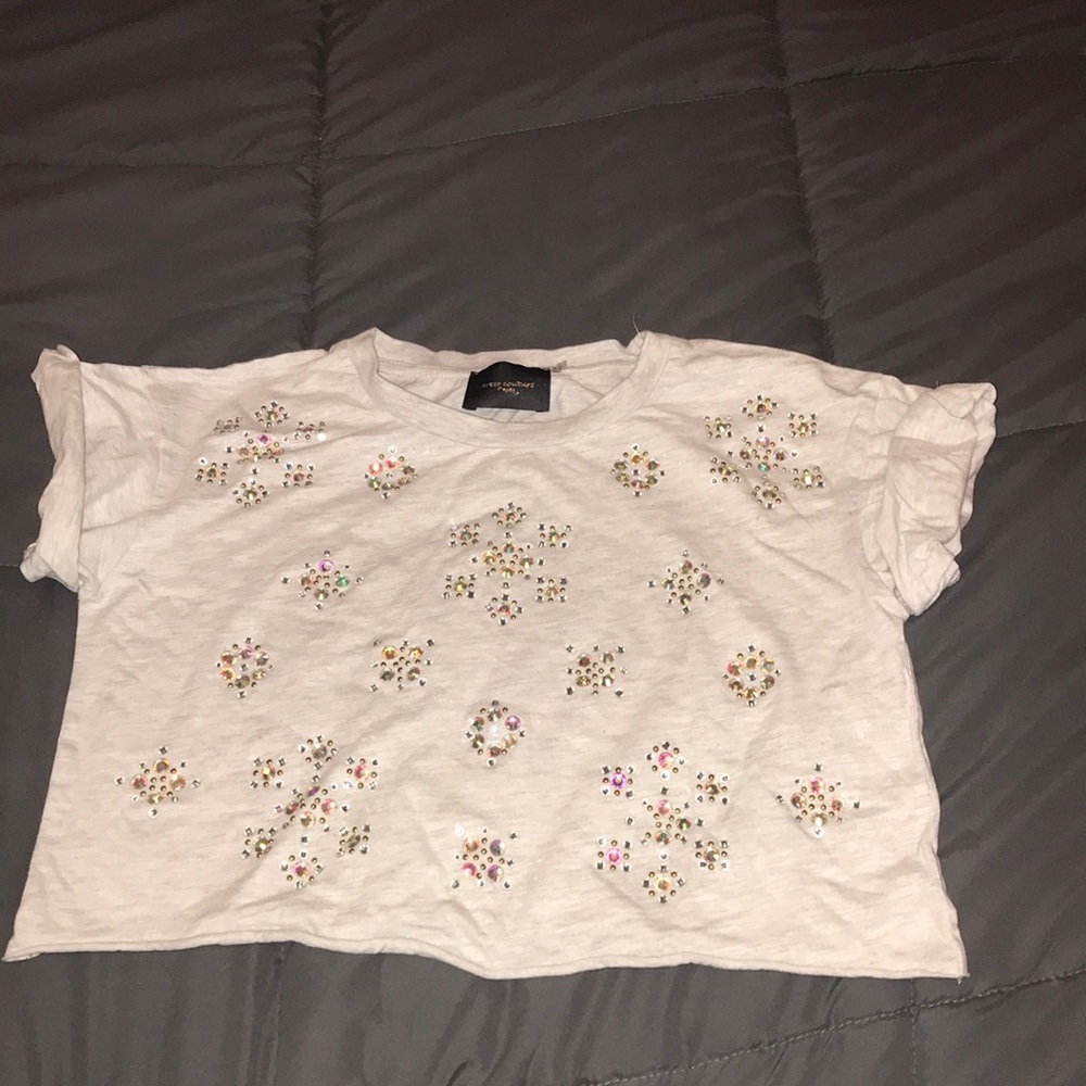 Rolled up sleeve  crop with embellishments.